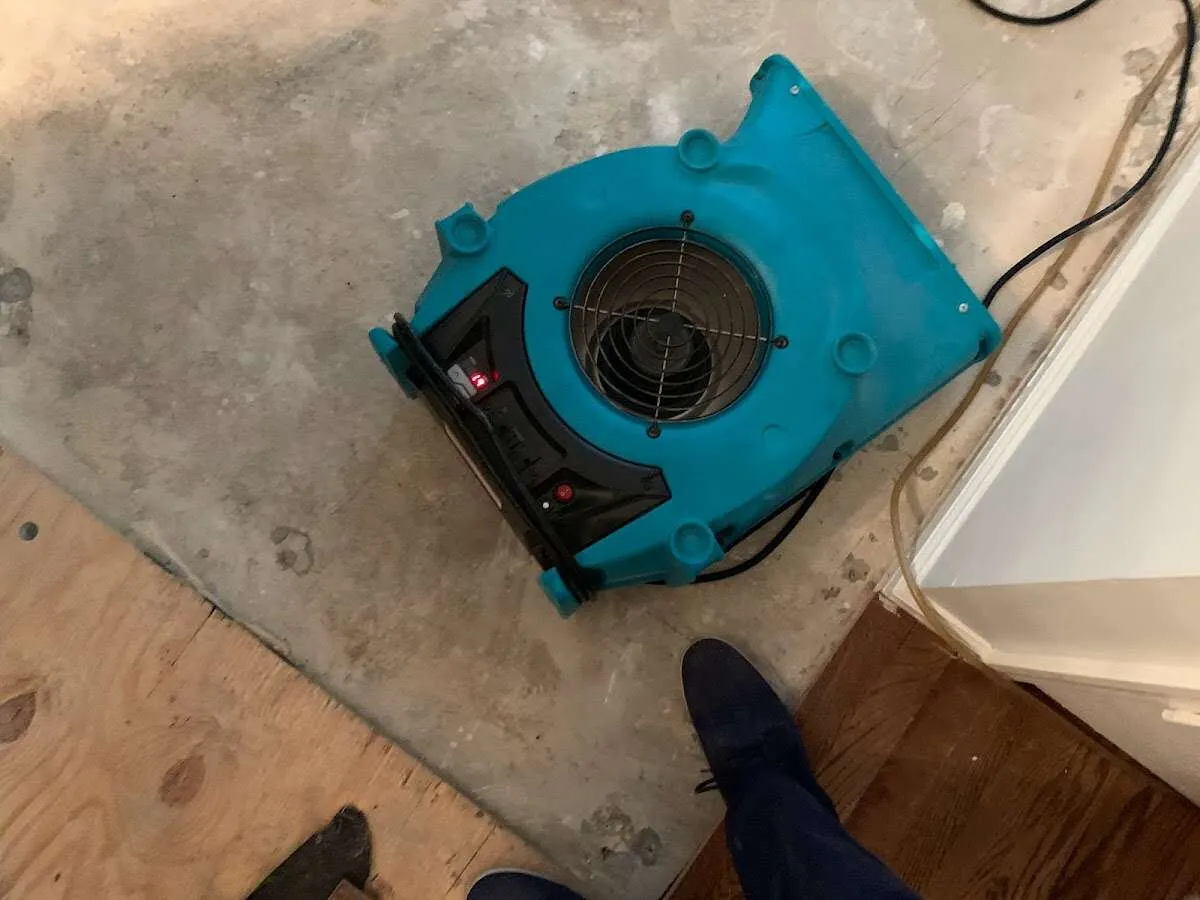 Air mover drying subfloor during Leak Detection & Repair in Pequannock